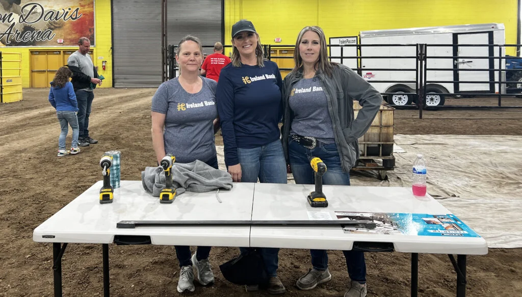 Staff from Ireland Banks Magic Valley branch help to build beds.